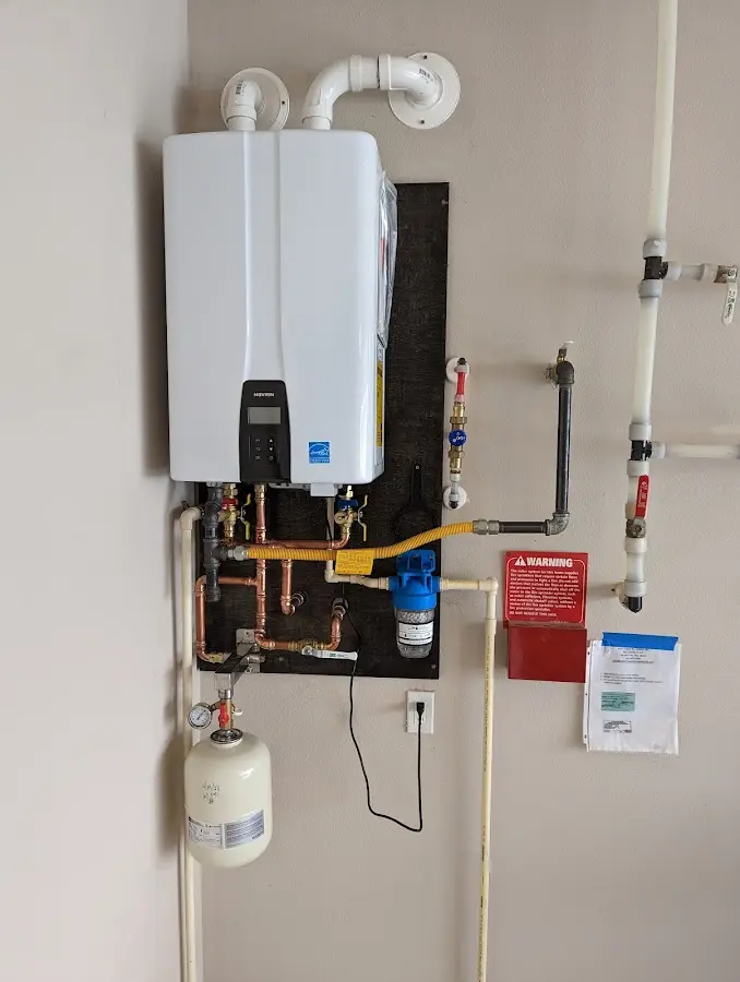 Professional plumber installing copper piping in a Vineland home